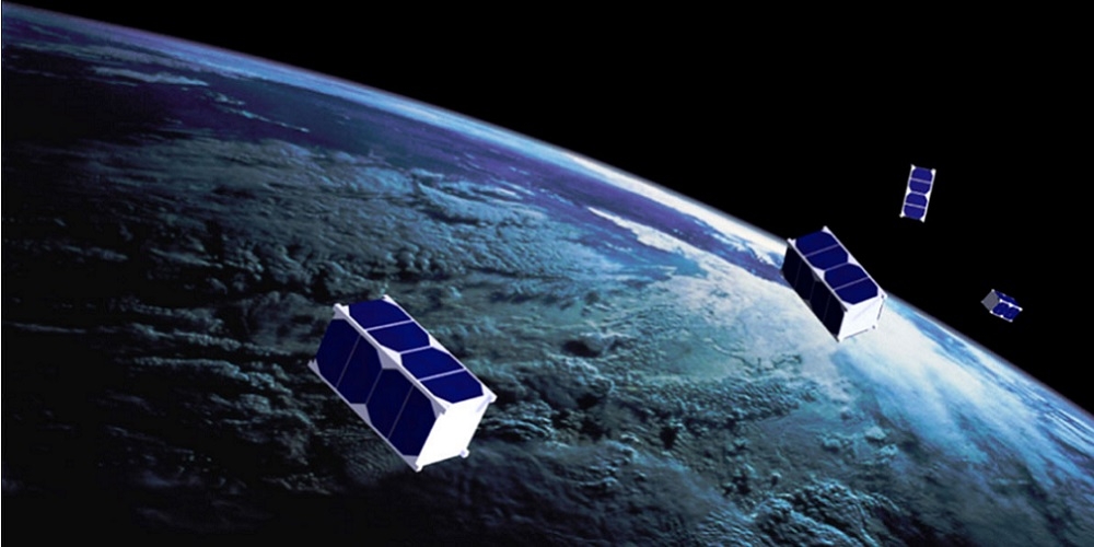 Artistieke impressie van cubesat satellieten in een baan om de Aarde.